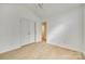 Bedroom showcases wood-look floors and a double-door closet for ample storage space at 4648 Madeline Dr, Rock Hill, SC 29732