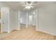 Open-concept living area featuring wood floors, white walls, and a ceiling fan at 4648 Madeline Dr, Rock Hill, SC 29732