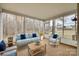 Inviting sunroom with cozy seating and screened windows offering serene outdoor views at 4648 Madeline Dr, Rock Hill, SC 29732