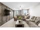 Bonus room with sectional sofa and wood-look accent wall at 4916 Abendego Rd, Charlotte, NC 28213