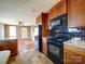 Kitchen with granite countertops and dark wood cabinets at 504 Washington St, Cramerton, NC 28032