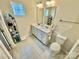 Well-lit bathroom with double vanity, large mirror, toilet, and tile flooring at 505 Grandiflora Ave, Lancaster, SC 29720