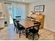 Bright dining area with wood table, black chairs, and sliding glass doors to the patio at 505 Grandiflora Ave, Lancaster, SC 29720
