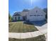 Charming single Gathering home with a manicured lawn, two-car garage, and light gray siding at 505 Grandiflora Ave, Lancaster, SC 29720