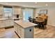 Open concept kitchen and dining area with stainless appliances, an island, and a walkout to the back at 505 Grandiflora Ave, Lancaster, SC 29720