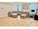 Cozy living room with a large sectional couch, light wood floors and a large window at 505 Grandiflora Ave, Lancaster, SC 29720