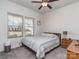 Cozy bedroom with striped bedding, wood nightstand, and ceiling fan at 5220 Admirals Lndg, Lancaster, SC 29720