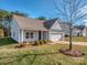 Ranch style home with gray siding, 2 car garage and landscaping at 5220 Admirals Lndg, Lancaster, SC 29720
