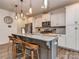 Kitchen features granite countertops, stainless steel appliances, and an island with seating at 5220 Admirals Lndg, Lancaster, SC 29720