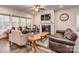 Spacious living room with a fireplace, large windows and comfortable seating at 5220 Admirals Lndg, Lancaster, SC 29720