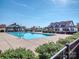 Community pool with adjacent clubhouse and ample deck space at 5220 Admirals Lndg, Lancaster, SC 29720