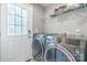 Bright laundry room, featuring washer, dryer, and storage at 532 Ernest Wright Rd, Lancaster, SC 29720