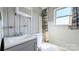 Clean bathroom with gray vanity, shower/tub combo and window at 556 6Th St, Chester, SC 29706