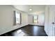 Bright bedroom with dark hardwood floors and two windows at 556 6Th St, Chester, SC 29706