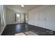 Simple bedroom with dark hardwood floors and double door closet at 556 6Th St, Chester, SC 29706