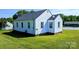 Side view of a small white house at 556 6Th St, Chester, SC 29706