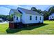Front view of a small white house with porch at 556 6Th St, Chester, SC 29706