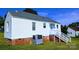 White house exterior with brick base and steps at 556 6Th St, Chester, SC 29706