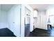 Kitchen area with white cabinets and dark hardwood floors at 556 6Th St, Chester, SC 29706