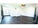 Bright living room featuring dark hardwood floors and a ceiling fan at 556 6Th St, Chester, SC 29706