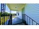 Inviting covered porch with metal railings offering a relaxing outdoor space at 556 6Th St, Chester, SC 29706