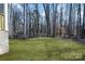 Wooded backyard view adjacent to a new home at 5618 Pine St, Charlotte, NC 28269