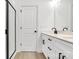 Clean bathroom with double vanity, quartz countertop and a walk-in shower at 5618 Pine St, Charlotte, NC 28269