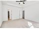 Spacious bedroom with carpet and access to a walk-in closet at 5618 Pine St, Charlotte, NC 28269