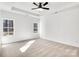 Bright and spacious bedroom with neutral carpeting and large windows at 5618 Pine St, Charlotte, NC 28269