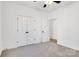 Bright bedroom with double doors and ceiling fan at 5618 Pine St, Charlotte, NC 28269