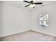 Bright bedroom with carpet, window, and ceiling fan at 5618 Pine St, Charlotte, NC 28269