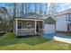 Newly built home with gray siding and a white garage door at 5618 Pine St, Charlotte, NC 28269
