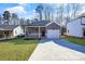Newly built home with gray siding and a white garage door at 5618 Pine St, Charlotte, NC 28269