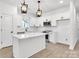 Modern kitchen with white shaker cabinets, quartz countertops, and stainless steel appliances at 5618 Pine St, Charlotte, NC 28269