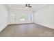 Bright living room featuring hardwood floors and an abundance of natural light at 5618 Pine St, Charlotte, NC 28269