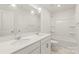 A bathroom with double sinks, white countertops, and a tub/shower combo at 7324 Teague Dr, Gastonia, NC 28056