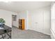 Bright bedroom featuring neutral carpeting, closet doors, and a window providing natural light at 7324 Teague Dr, Gastonia, NC 28056