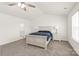 Bright bedroom features neutral carpet, ceiling fan, and two large windows at 7324 Teague Dr, Gastonia, NC 28056