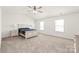 Spacious bedroom featuring vaulted ceiling, neutral carpet, and large windows at 7324 Teague Dr, Gastonia, NC 28056