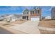 Charming home with a two-car garage, driveway, brick and vinyl siding at 7324 Teague Dr, Gastonia, NC 28056