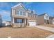 Charming home with a two-car garage, driveway, brick and vinyl siding at 7324 Teague Dr, Gastonia, NC 28056