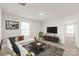 Bright living room with modern sofa, TV, area rug, and contemporary decor at 7324 Teague Dr, Gastonia, NC 28056