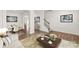 Bright living room with hardwood floors, white walls, area rug, a couch, and view to the dining room at 7324 Teague Dr, Gastonia, NC 28056