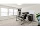 Home office featuring a large desk, multiple monitors, and natural light at 7324 Teague Dr, Gastonia, NC 28056