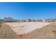 A large, sandy volleyball court ready for games with surrounding homes at 7324 Teague Dr, Gastonia, NC 28056