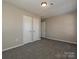 Bedroom with double closets and neutral carpeting at 738 Rudd Ct, Charlotte, NC 28216