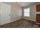 Dining area with wood-look floors and view of the kitchen at 738 Rudd Ct, Charlotte, NC 28216