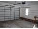 Spacious garage with overhead door, shelving, and workbench at 843 Fairway Dr # 44, Kannapolis, NC 28081