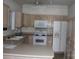 Kitchen with light wood cabinets, appliances, and an island at 843 Fairway Dr # 44, Kannapolis, NC 28081
