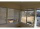 Sunroom with large windows and blinds, showcasing a view of the surrounding landscape at 843 Fairway Dr # 44, Kannapolis, NC 28081